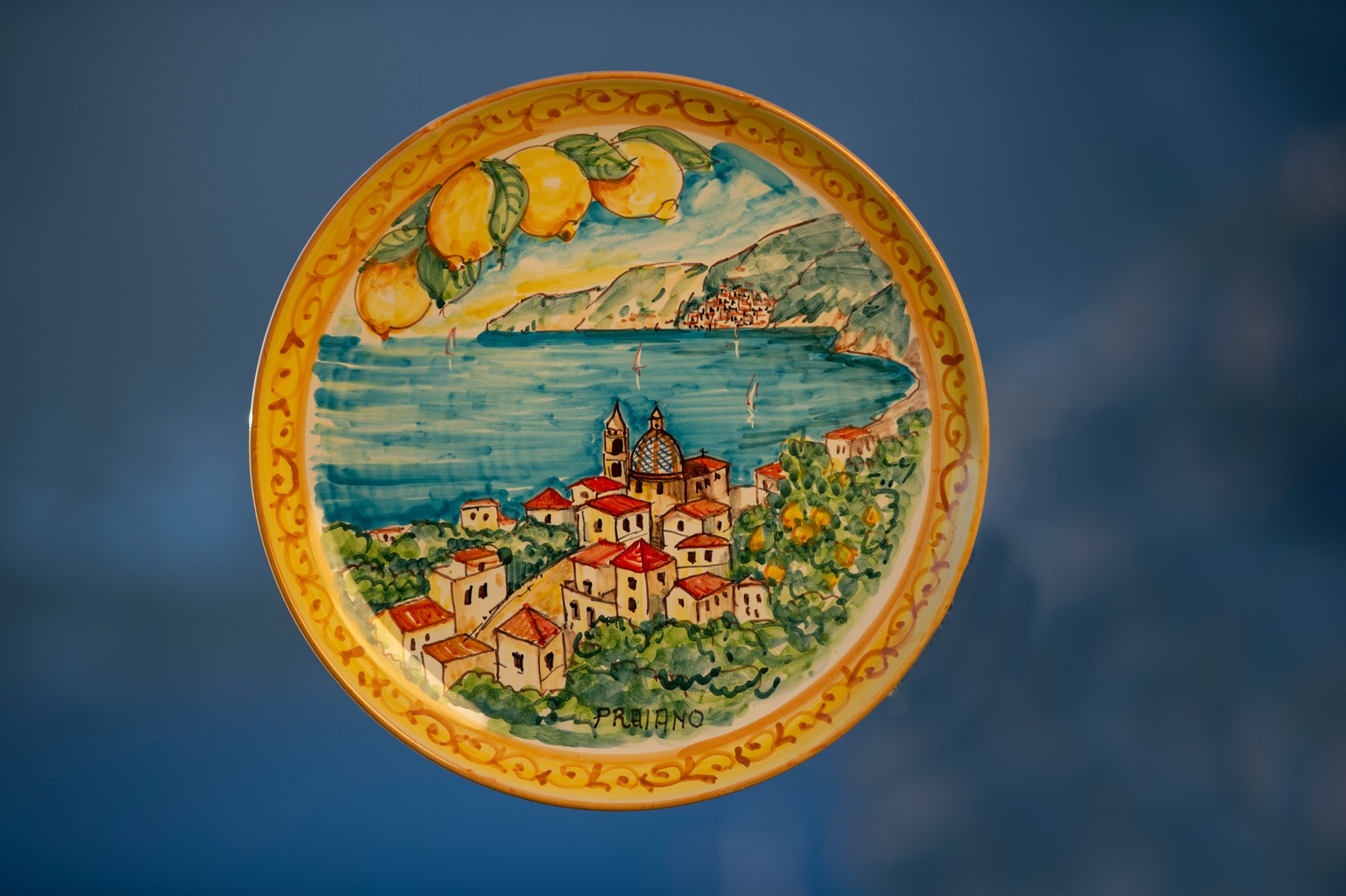 Hand painted wall plate portrays the beautiful Village of Praiano